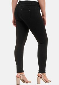 Elara STRETCH - Vaqueros pitillo - schwarz