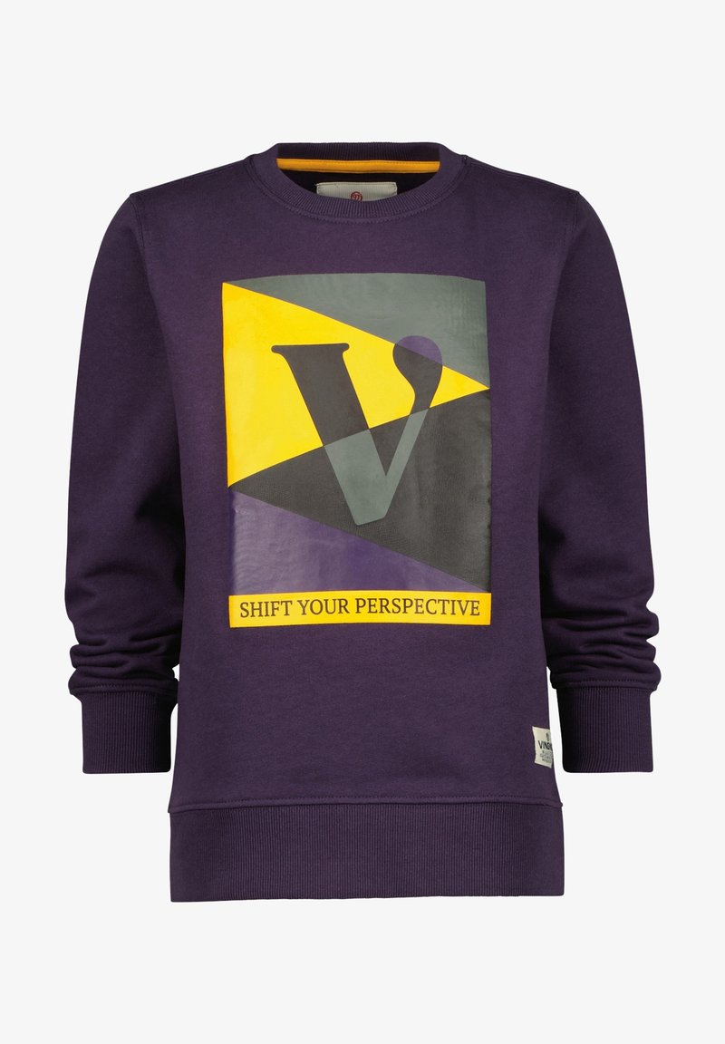 Sweat-shirt violet à col rond, avec un imprimé géométrique en jaune, gris et noir, et le texte "CHANGEZ DE PERSPECTIVE" en bas.