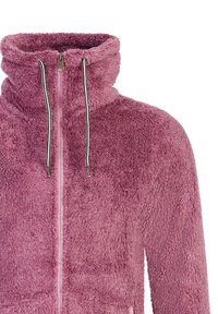 Chlpatá ružová zipsová bunda s vysokým golierom, ktorá má čierno-biele šnúrky a mäkkú, textúrovanú látku.
