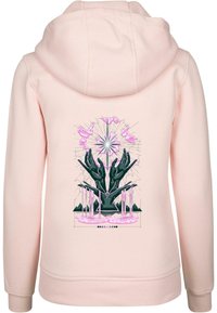 Felpa rosa con un design grafico sul retro, che raffigura mani nere circondate da accenti rosa ed elementi geometrici. Tessuto morbido.