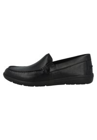 Black leather slip-on shoes featuring a smooth surface, rounded toe, and textured sides with a flexible rubber sole.