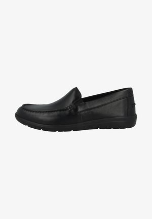Chaussures noires en cuir à enfiler, avec une surface lisse, un bout arrondi et des côtés texturés, dotées d'une semelle en caoutchouc flexible.