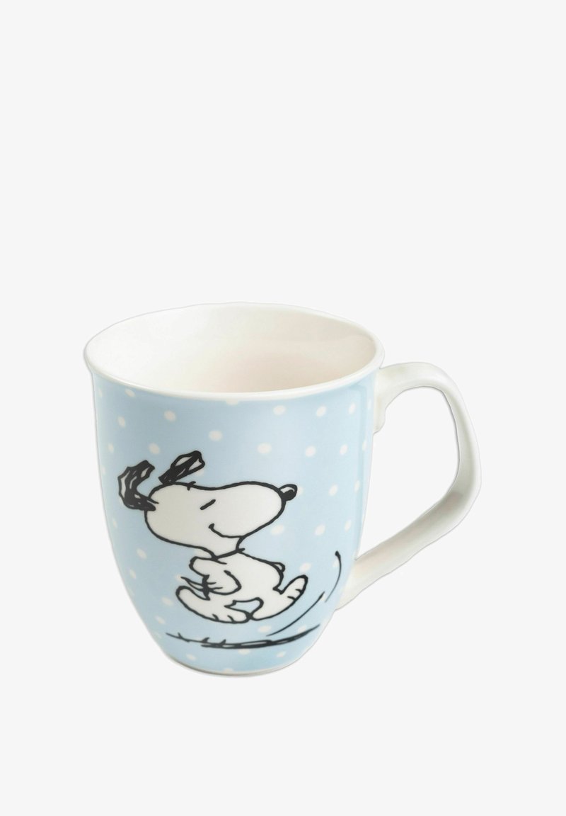 Tazza in ceramica con uno sfondo azzurro chiaro, pois bianchi e un cane cartone con contorni neri. Texture liscia, forma arrotondata, manico su un lato.