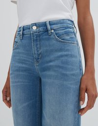 Light blue denim jeans with a high waist, front pockets, a zip fly, and silver hardware. The fabric has a smooth, slightly textured finish.