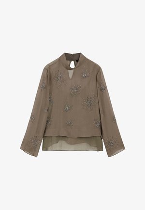 Brun bluse med lange ærmer og nøglehulshalsudskæring, pyntet med sølv perledekorerede stjernemønstre, lagdelt design og transparent stof.