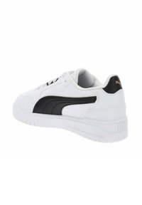 White sneakers with black accents and a textured design. Features a rubber sole, lace-up front, and a logo on the heel.
