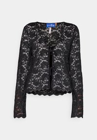 Cardigan noir à manches longues en dentelle florale avec encolure en V et deux fermetures à nouer à l'avant, tissu semi-transparent, ourlet et poignets festonnés.