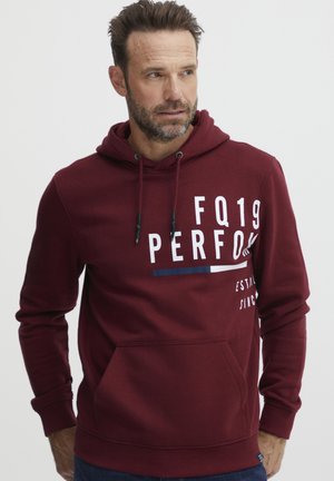 Maroon hooded sweatshirt in soft fabric, featuring a front pocket, white and blue graphics, and adjustable drawstring.