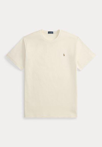 Krém bézs színű rövid ujjú Polo Ralph Lauren póló kerek nyakkivágással és kis hímzett logóval a bal mellrészen.