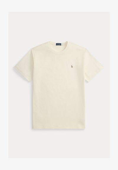 Krém bézs színű rövid ujjú Polo Ralph Lauren póló kerek nyakkivágással és kis hímzett logóval a bal mellrészen.