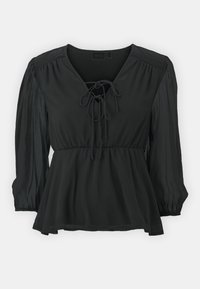 Svart peplumblus med V-ringning och knytning, långa ärmar med rynkade manschetter och ett texturerat, lätt tyg.