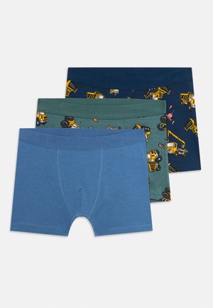 Three boys' boxer briefs stacked, in solid blue, green with yellow construction trucks, and navy with yellow dump truck patterns.