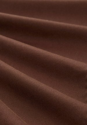 Brown fabric with a smooth texture, featuring subtle wrinkles and folds, showcasing a rich, deep color without patterns or embellishments.
