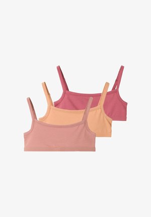Trois hauts bralette en coton sans coutures dans des tons rose, pêche et rose atténués, avec fines bretelles réglables, disposés en chevauchement.