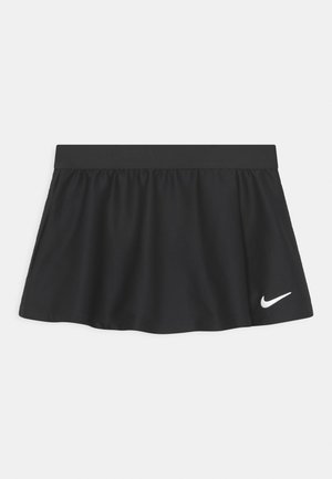 Melna sporta svārki ar ribotu tekstūru, elastīgu jostu un balto Nike logo apakšējā labajā stūrī.