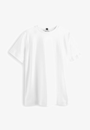 Bijela majica kratkih rukava od pamuka, s okruglim izrezom, ravnim rubom i mekanom, glatkom teksturom. Bez uzoraka ili grafika.