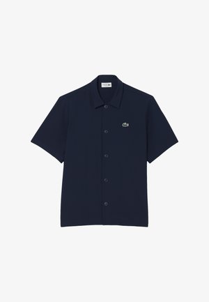 Dunkelblaues kurzärmliges Hemd aus Baumwollmischung, mit durchgehender Knopfleiste und einem Lacoste-Krokodil-Logo auf der linken Brust.