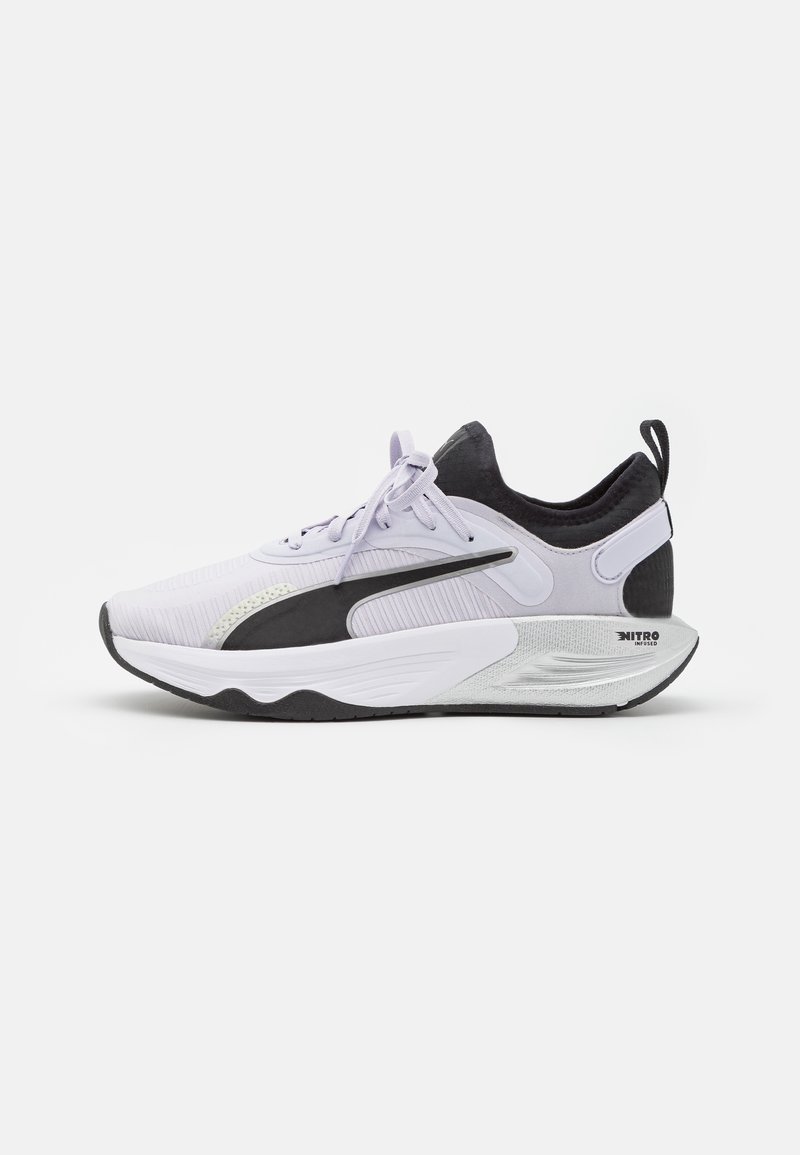 Running shoe in lavender and black, featuring a textured upper, cushioned sole, and prominent branding on the heel and side.