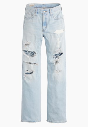 Ανοιχτό μπλε τζιν παντελόνι με πολλά μεγάλα σκισίματα και ξεφτισμένες άκρες στους μηρούς και τα γόνατα, σε ίσια γραμμή.