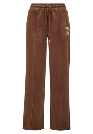 Pantalones de chándal de terciopelo marrón con cintura elástica, cordón y bolsillos laterales. Presenta costuras en tono y un logo en la parte delantera.