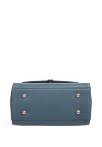 Rectangular blue leather handbag bottom with four gold metal feet on a white background.