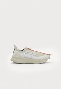 Lightweight athletic shoe in light gray and white, featuring a textured upper, prominent three-stripe design, and bright orange laces.
