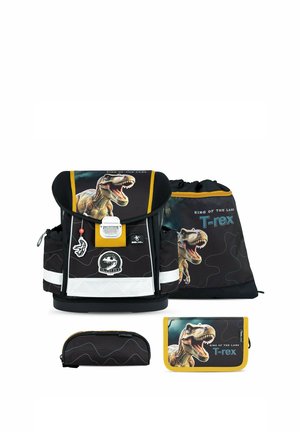 Set zaino scolastico nero e giallo con dinosauro T-rex ruggente e scritta "King of the Land", incluso borsa, astuccio e portafoglio.
