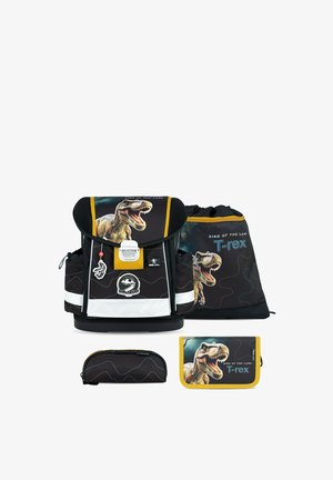 Set zaino scolastico nero e giallo con dinosauro T-rex ruggente e scritta "King of the Land", incluso borsa, astuccio e portafoglio.
