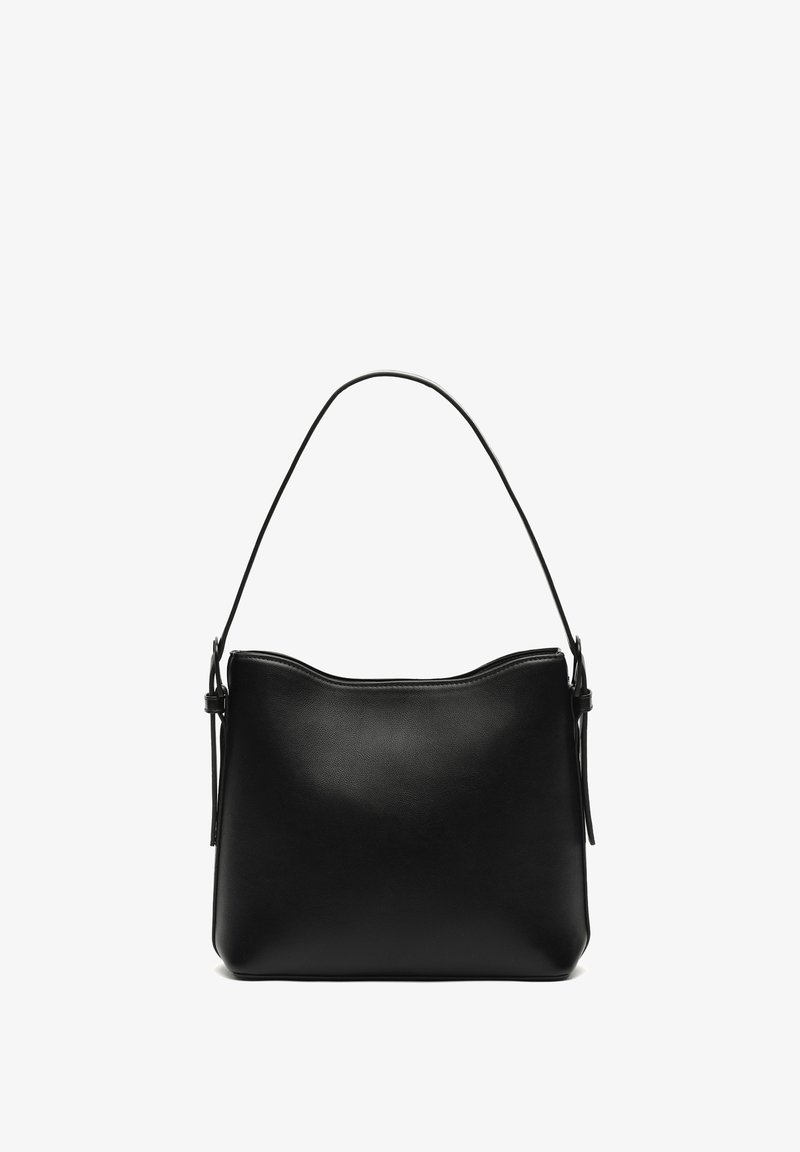Black leather handbag with a smooth texture, curved top, and a single, slender shoulder strap. Minimalist design with no visible hardware.