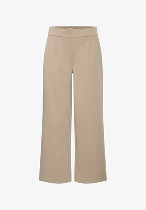 Beżowe spodnie o szerokich nogawkach, wykonane z miękkiego materiału o gładkiej fakturze, z wysokim stanem i bocznymi zakładkami dla dodatkowego efektu wizualnego.
