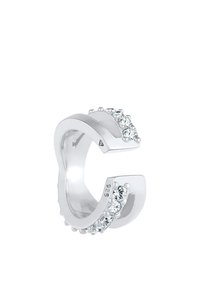 Anello d'argento con una forma aperta unica, caratterizzato da una fila di piccoli cristalli trasparenti su un lato e contrassegnato con "925" per argento sterling.