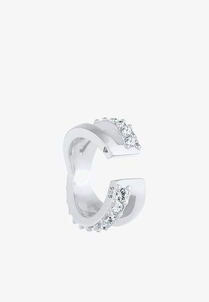 Inel din argint cu o formă deschisă unică, având un rând de cristale mici și clare pe o latură și marcat cu "925" pentru argint sterling.