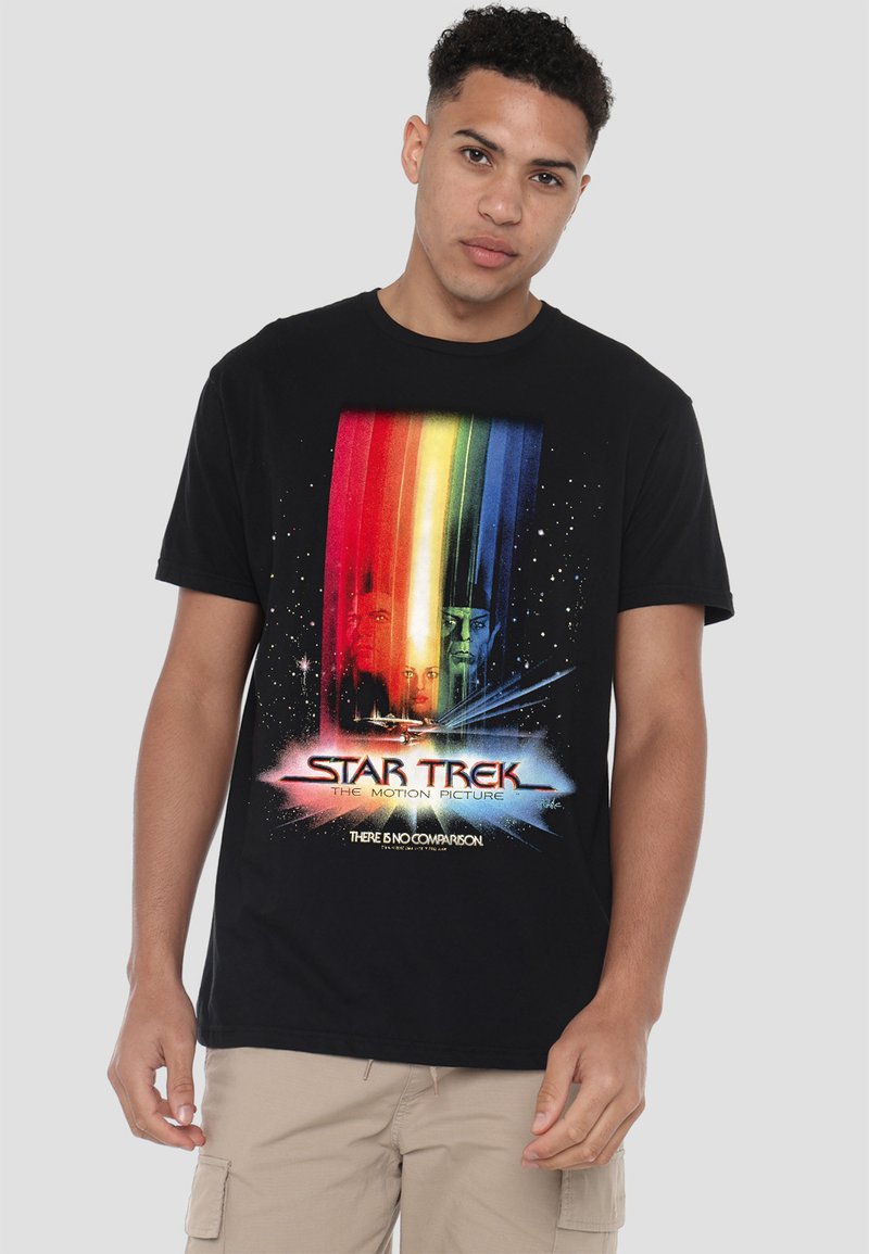 Black cotton t-shirt featuring a colorful "Star Trek: The Motion Picture" graphic with rainbow stripes and space-themed accents.