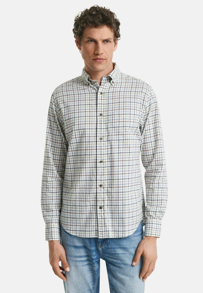 Herenoverhemd met kraag in een wit en blauw geruit patroon, met knoopsluiting, lange mouwen en een enkele borstzak. Zachte katoenstof.