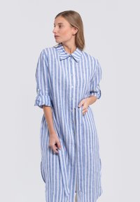 Blue and white striped long shirt dress with a button-down front, a classic collar, and rolled-up sleeves, made from lightweight fabric.