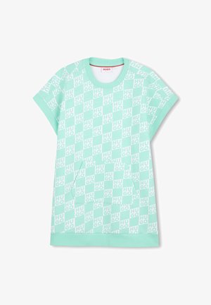 T-shirt manches courtes vert menthe avec un motif en damier et le texte répété "HUGO", doté d'une poche avant. Matière en coton doux.