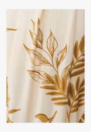 Crème stof met gouden botanische print, met gestileerde bladeren en bloemen. Zachte textuur en delicate details overal.