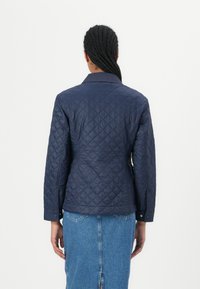 Tommy Hilfiger PADDED SLIM QUILTED JACKET - Light jacket - dark night navy
