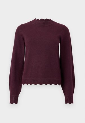 Burgundy kötött pulóver hosszú ujjal, hullámos nyakkivágással és szegély részletekkel. Puha tapintású, testhez simuló kialakítás ribbelt akcentusokkal.