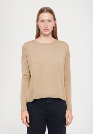 Maglione beige a maniche lunghe con colletto rotondo e vestibilità morbida. Realizzato in materiale soffice, presenta spalle scese e un orlo cropped.