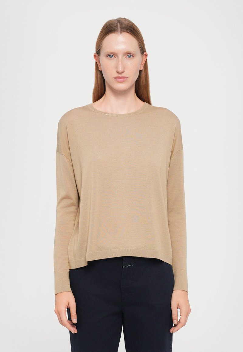 Tan long-sleeve sweater with a round neckline and relaxed fit. Made of soft material, featuring dropped shoulders and a cropped hem.