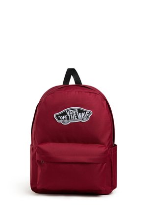Red fabric backpack with a rounded shape, featuring a front zip pocket and a prominent black and white "Off the Wall" logo patch.