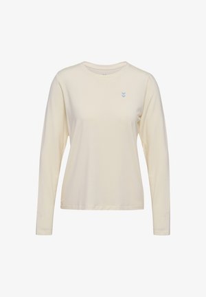 Koszula z długim rękawem w jasnym kremowym kolorze, wykonana z miękkiego materiału. Posiada małe niebieskie logo na piersi oraz okrągły dekolt.