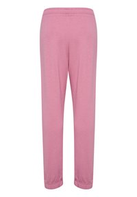 Rosa sweatpants i mjukt tyg, med elastisk midja och smala ben med ribbade muddarna, slät yta utan mönster.