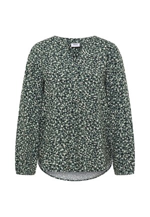 Vihreä pitkähihainen paita, jossa on napitus edessä, ja joka esittelee abstraktia beige ja tummanvihreää kuviota. Pehmeä, kevyt kangas ja kaareva helma.