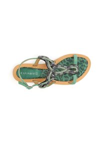 Sandalina piatta verde con plantare a stampa leopardata, cinturino perlaceo con design a spirale e fibbia alla caviglia regolabile. Leggera e alla moda.