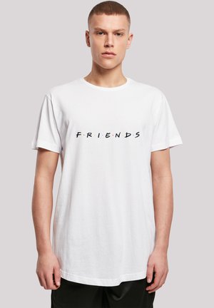 White cotton t-shirt featuring the word "FRIENDS" in black letters with colorful dots above and below. Standard crew neckline and short sleeves.