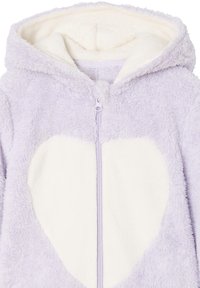 Purple fleece hoodie with a soft white heart design, front zipper, and hood. Texture is plush and fluffy, providing warmth and comfort.