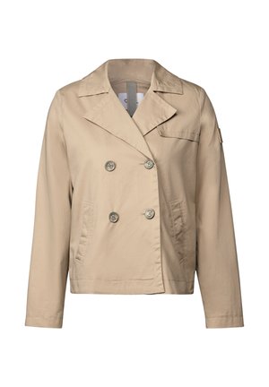 Beige takki, jossa on kaksinkertainen napitus, suuret napit, viisitaskut ja yksi rintatasku, valmistettu sileästä kankaasta.