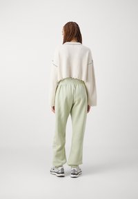 Nike Sportswear Träningsbyxor - green